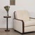 Solid dark oak circular drink table with carved ribbed detailing; inspired by French design. Designed in Los Angeles....