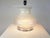 This large and elegant abat jour was produced in Italy around 1970s. It is made from a Murano faded glass base with an...
