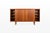 An elegant danish vintage highboard in teak by bramin, featuring gently curved front edges, distinctive recessed handles...
