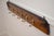 An attractive set of five twisted rope and ceramic coat hooks, mounted on a william iv figured mahogany backing. Dating to...