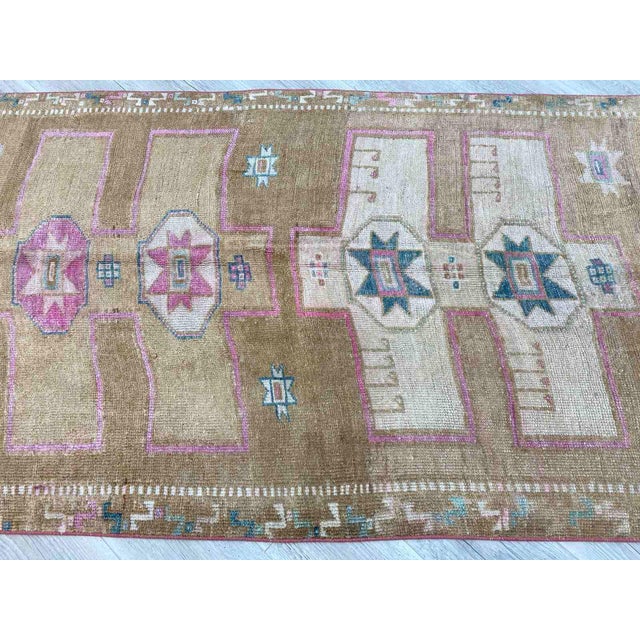This gorgeous hand knotted Vintage Anatolian area rug is approximately 60 years old in excellent vintage condition. The...