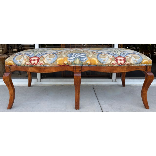Elegant and timeless traditional style bench by Donghia. Wooden structure with 5 legs. Large proportion flowers...