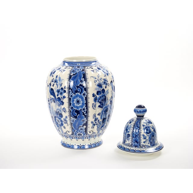 Large antique blue and white Delft covered jar, hand-painted in the Netherlands, circa 1880. The jar features a finely...