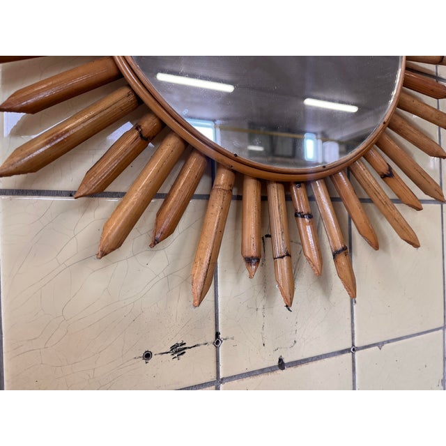 This sunburst mirror is crafted from bamboo and features a beautifully shaped frame that creates a warm and natural...