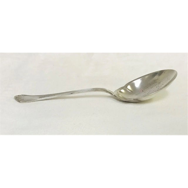 Elegant silver plated serving spoon by Reed & Barton. This is part of the 'Westwood' pattern from the 1920's. The stamps...