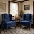 Elegant and classic pair of grand wingback chairs with a rich dark blue damask upholstery on a mahogany frame. Made after...