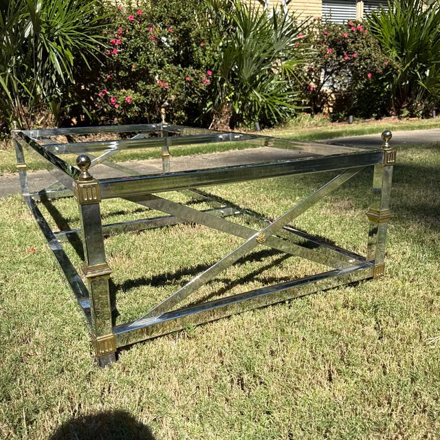 This is an elegant vintage coffee table, likely dating from the 1970s or 1980s, in the highly desirable Maison Jansen...