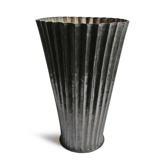 Vintage bronze fluted planter. Striking patina with blackened exterior and bronze interior with signs of age. Each...