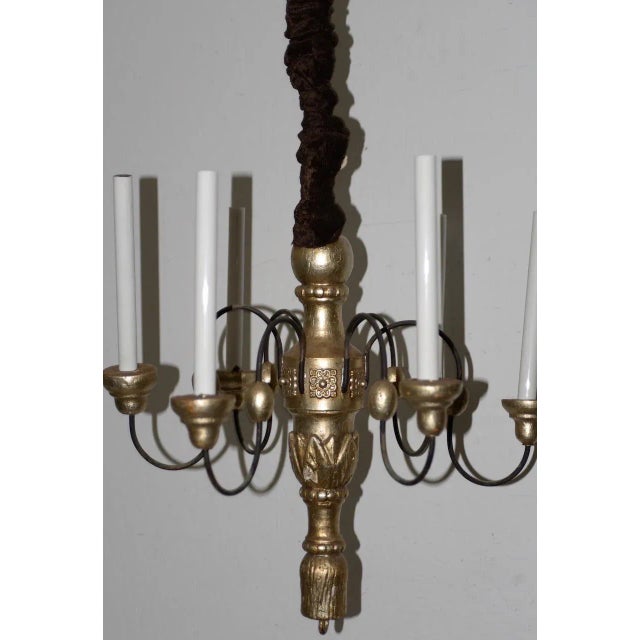 Vintage Carved Wood & Gilded Six Light Chandelier Nice vintage chandelier from carved wood. The chain was a corduroy...