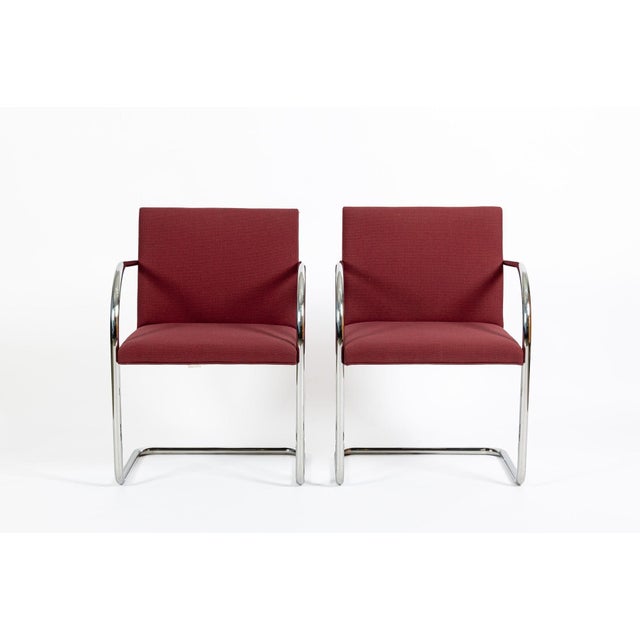 This pair of vintage red Brno arm chairs designed by Ludwig Mies van der Rohe were produced by Knoll in 1983. This iconic...