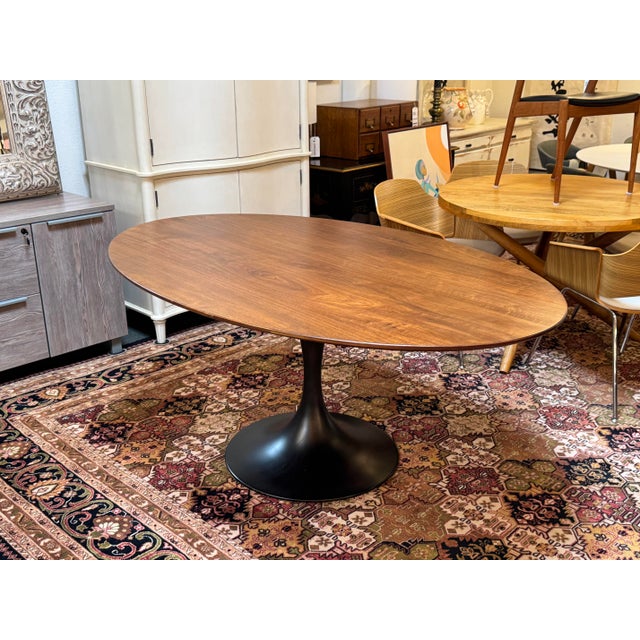 Design Plus Gallery presents a Walnut Tulip Table from Williams-Sonoma Home. The table has an oval surface that was...