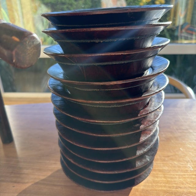 Beautiful vintage Chinese export wooden plate rack with matching lacquered wooden plates, dating to the mid-20th century...