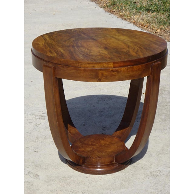 A genuine Art Deco table from the 1920s, crafted from solid walnut with a burr walnut top. Featuring curved and geometric...