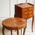A small, three-drawer bedside table in the louis xv style, produced around 1900 as a reproduction of 18th-century models....