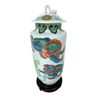Japanese Arita Foo dog Motif Covered Urn, with Carved Hardwood Stand For Sale