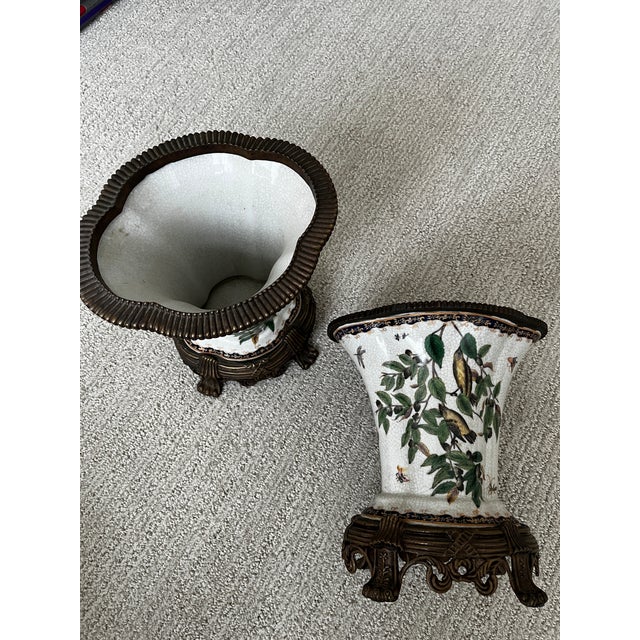 Purchased in the 1990s, pair of decorative crackle porcelain vases with bronze ormolu pedestals. Made in China - I believe...