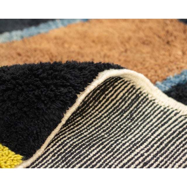 Exquisite wool rug, meticulously hand-knotted, featuring a deep Midnight Black background with bold, Luminous Yellow...