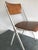 One mid-century Friso Kramer chairs. (Two available for additional $680)