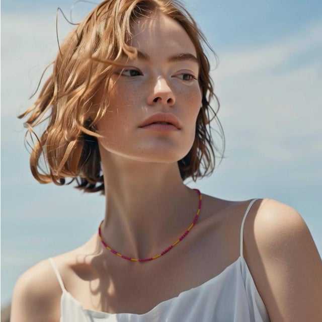 A quiet blaze of color — the Stella Ruby Necklace captures the warmth of sunlight at its most vivid. Radiant ruby beads...