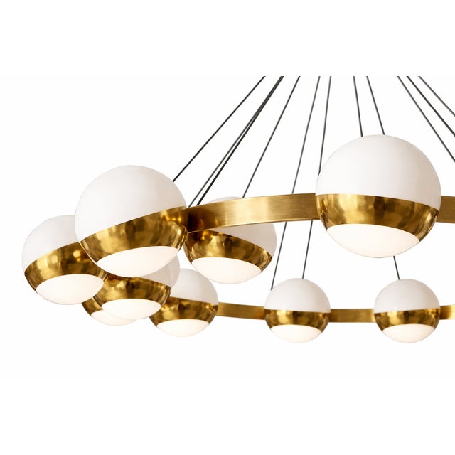 This lamp is an elegant and striking piece of contemporary design with Mid-Century inspiration. It features a circular...