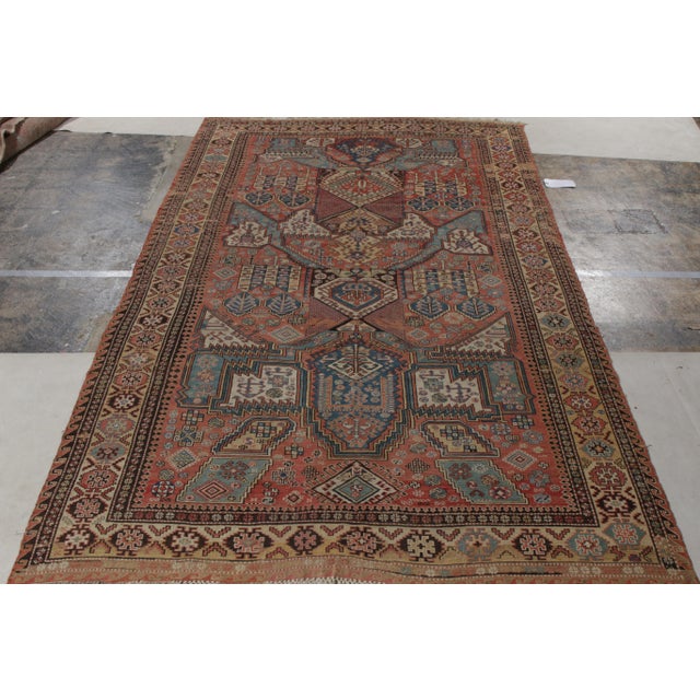 Hand knotted in wool, a rare antique dragon Soumak rug originating from Russia circa 1920-1930, relishing a union of a...