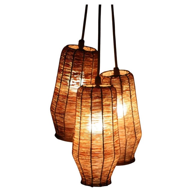We are so excited to tell you about this beautiful set of three handcrafted hanging lamps! It's a wonderful and rare find....