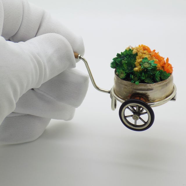 A vintage miniature depicting a flower cart, crafted in arezzo between the 1970s and 1980s in solid continental silver by...