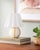 Illuminate your space with the Kinki accent table lamp, a captivating blend of Arts & Crafts Traditional style that...