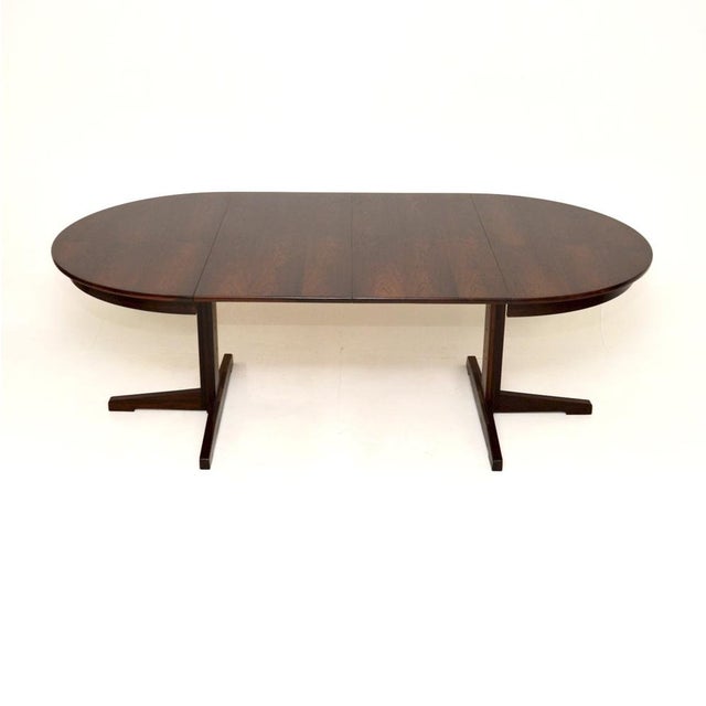 A very stylish and top quality Danish vintage extending dining table. This was made in Denmark, it dates from the 1960’s....