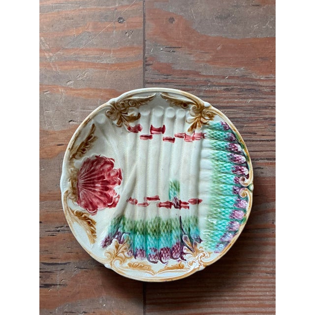 A delightful and highly collectible piece of French ceramic art, this antique majolica asparagus plate is a true classic...
