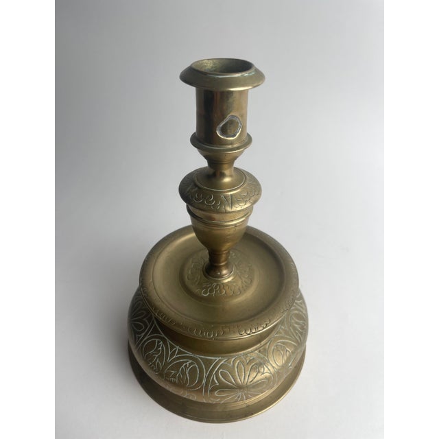 This 17th-century Nuremberg candlestick, crafted in the classic bell form, is a striking example of German metalwork from...