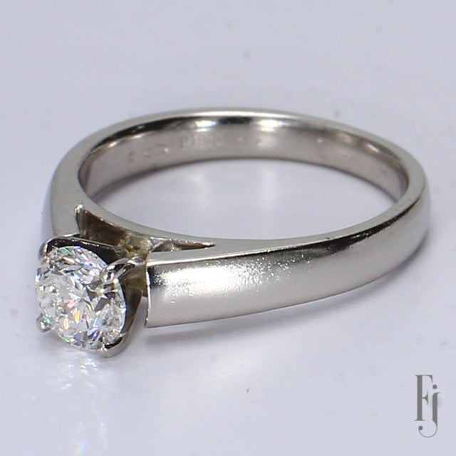 This is a platinum cathedral style ring with a 5.43mm Round SI2/F Diamond Weighing ~0.5ctw Ring Size - 5.75 Total Weight -...