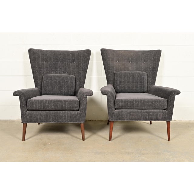 An outstanding pair of Mid-Century Modern wingback lounge chairs By Paul McCobb for Custom Craft Furniture, "Planner...