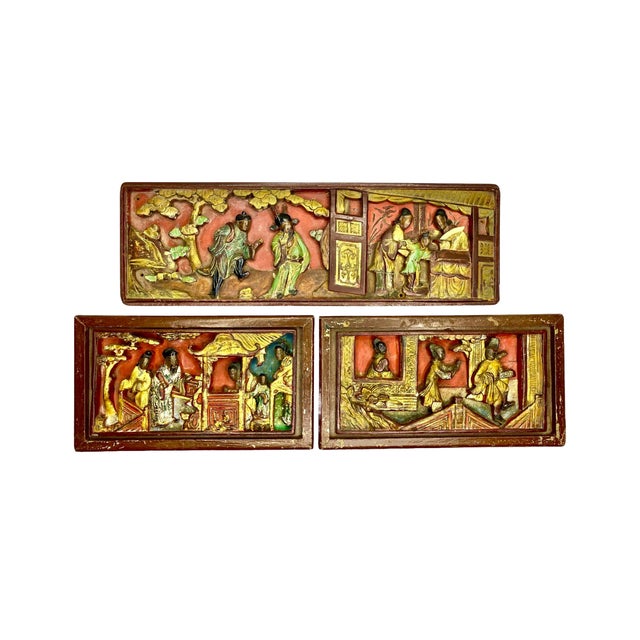 A rare, museum-worthy set of 3 antique Chinese gilt and lacquered wood panels, hand-carved in deep relief and richly...