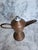 This is a copper/brass snotneus (snotnose) whale oil lamp. It has a pedestal base and a lidded resevoir with a distinctive...