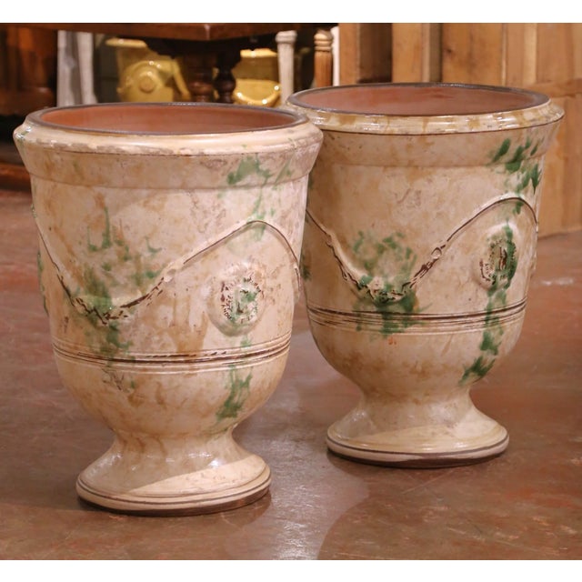 This impressive pair of French Anduze terracotta garden vases originates from Anduze, a historic pottery center celebrated...