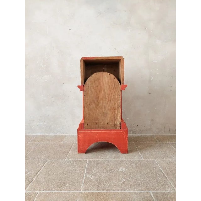 Antique table altar or tabernacle, patinated in orange terra color with golden doors. h 95 x w 50 x d 47 cm.