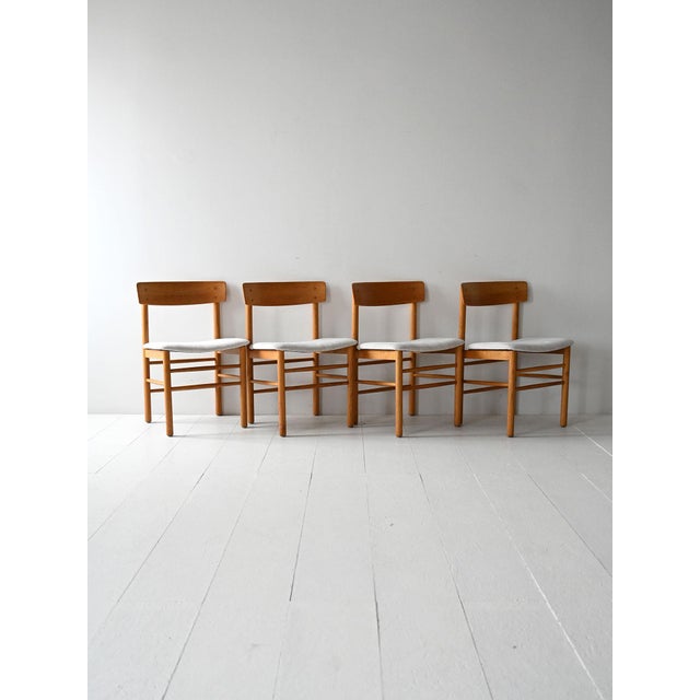 Model 250 chairs in solid oak with a curved backrest and padded seat. Made by Farstrup Møbler, Denmark, 1956. Set of four...