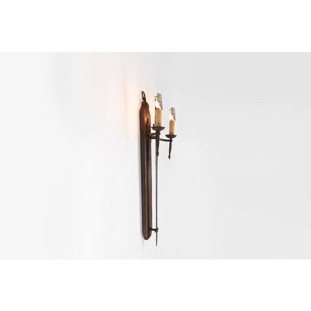 A large wall lamp with a metal sword in wrought iron is a unique and original choice for a home. This lamp has a beautiful...