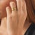 This vintage eternity band features 8 round brilliant cut diamonds totaling approximately 0.40 carat, arranged in a...