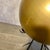 This unique sculpture features a large gold sphere cradled among metal locust tree thorns. Designed by Barry Dixon for...