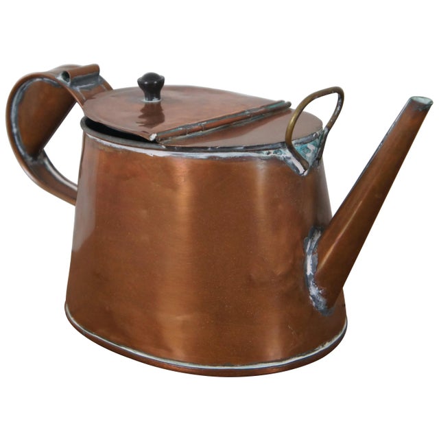 Antique 19th century copper tea kettle with oval body, straight spout, large flip top opening, hefty handle and brass ring...