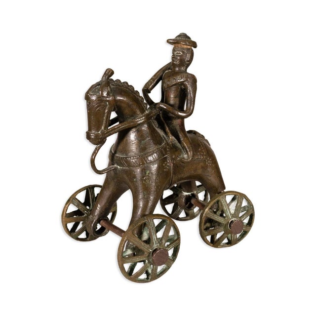This charming pair of antique Indian bronze figurines showcases traditional folk craftsmanship. Circa early 20th century....
