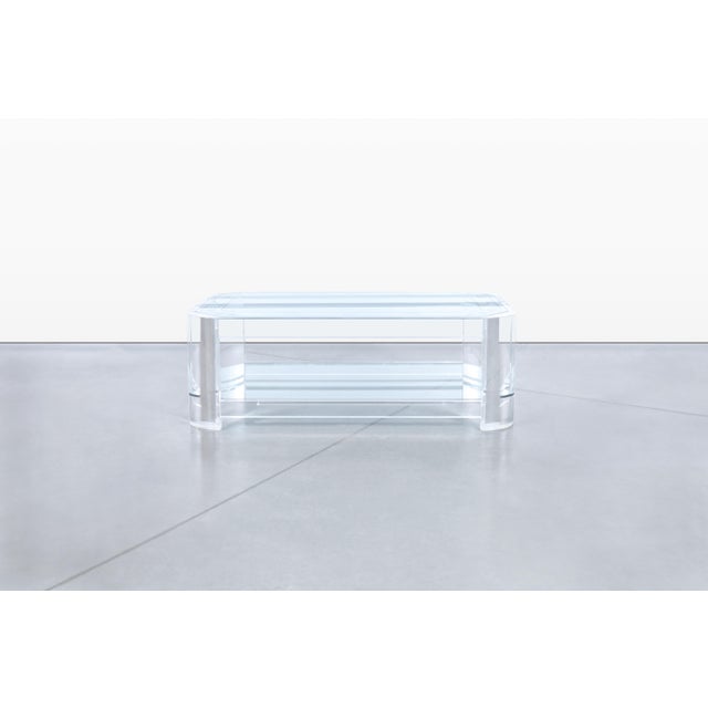 This exquisite vintage lucite coffee table, manufactured by Les Prismatiques in New York circa the 1980s, is a stunning...