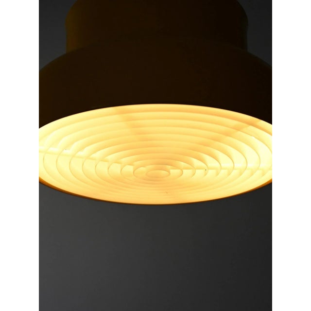 Iconic Bumling ceiling lamp designed by Anders Pehrson for Ateljé Lyktan in the 1960s. This yellow lacquered metal version...