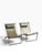 Pair of sling chairs by Roman and Williams Guild in blackened steel and leather. While unmarked, these chairs were part of...