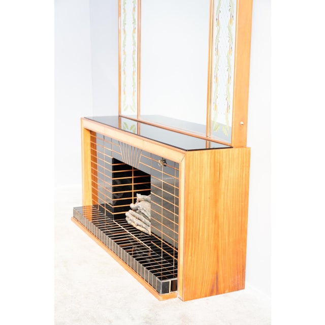 Fire -shaped sideboard, tessellated in black opal glass outlined by acesse profiles, the 45 -degree closing counter opens...