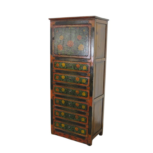 This vintage Tibetan chest is colorfully decorated with exuberant flowers to represent the exotic Tibetan culture and its...