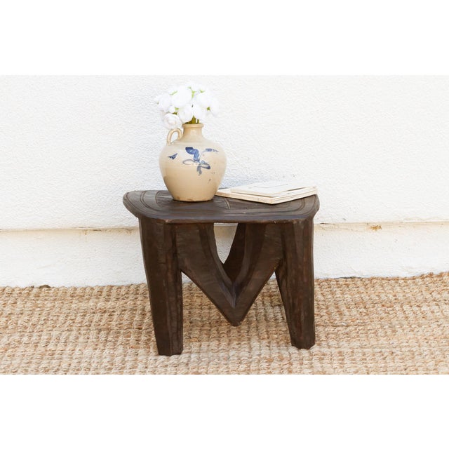 A unique piece of African art, this vintage Nupe table from Nigeria is a must-have for collectors and enthusiasts of Nupe...