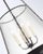 Designer Marie Flanigan Reese 18" Pendant in dark Bronze Finish and Clear Restoration Glass. Specifications: Height:...